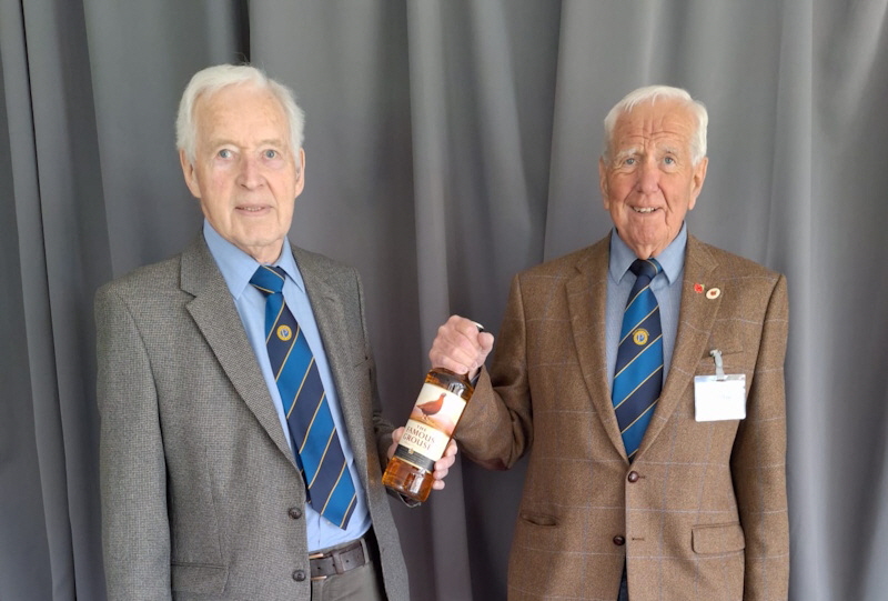 Trevor Carter presents whisky to Peter Wilkinson 2025-04-09 800